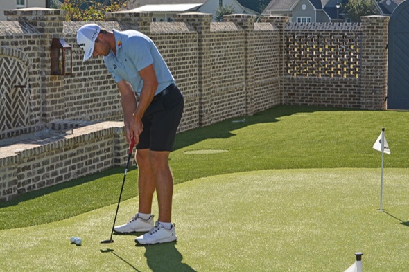 Huntsville Golfer putting on synthetic grass